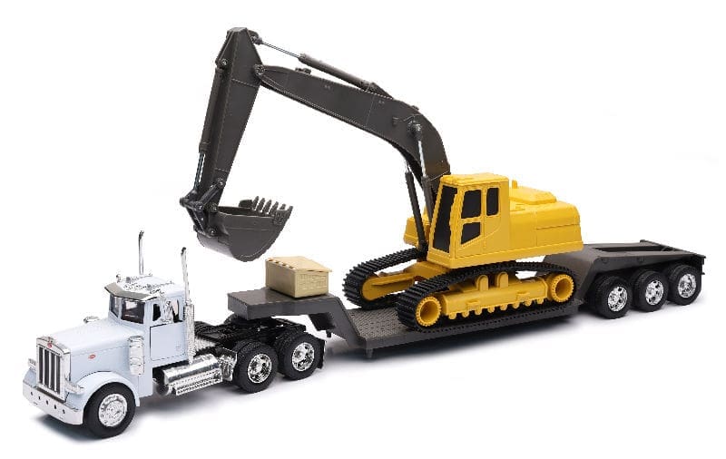 A toy truck with a large yellow and black tractor on it.