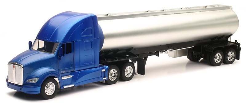 A blue truck with a silver tanker trailer.