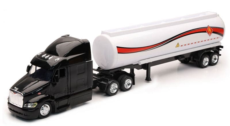 A toy semi truck with a trailer on the back.