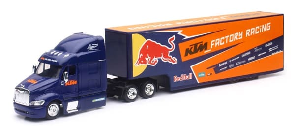 A toy truck with the red bull logo on it.