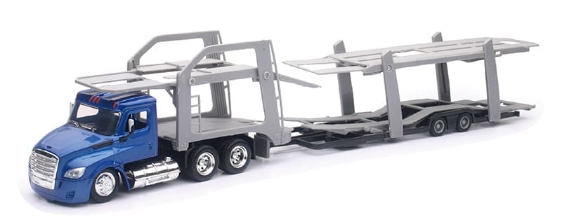 A toy truck is being loaded with a trailer.