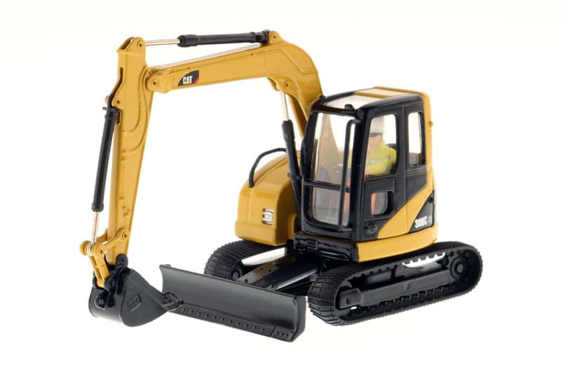 A yellow and black toy excavator is on display.