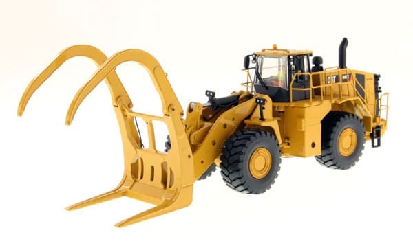 A yellow wheel loader with a large fork.