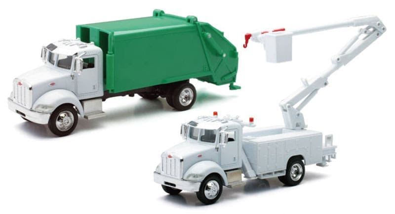A toy truck and garbage truck are next to each other.