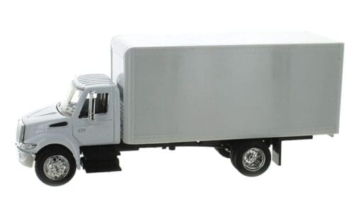 A white truck with its bed open.