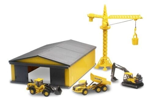 A toy construction site with a crane and trucks.