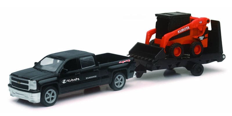 A toy truck and trailer with an orange tractor.