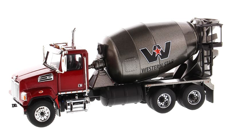 A red truck with cement mixer on the back.