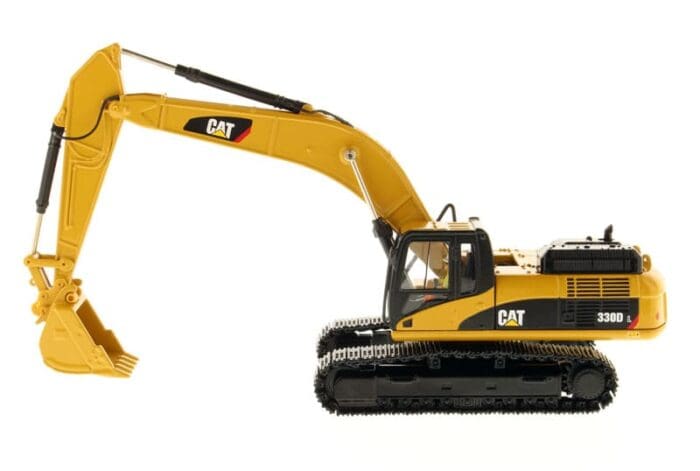 A yellow and black cat construction vehicle is on the ground.