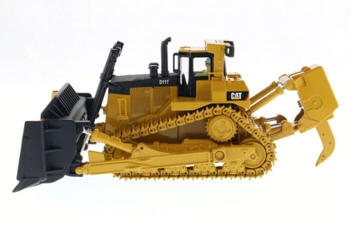 A yellow and black cat bulldozer with a fork.