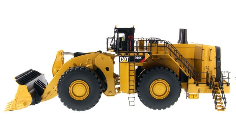 A yellow cat 9 8 0 k wheel loader with stairs.