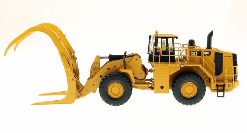 A yellow construction vehicle with a large front loader.