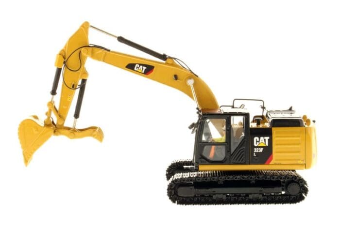 A yellow and black cat excavator is on the ground