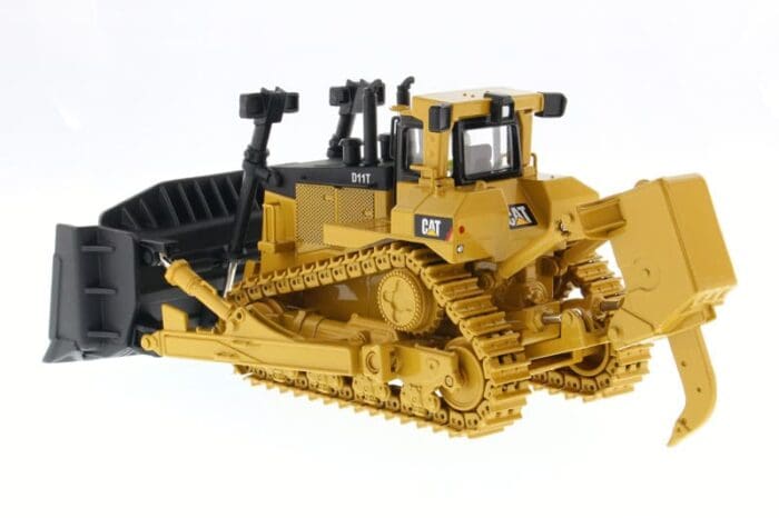 A yellow and black cat bulldozer on display.