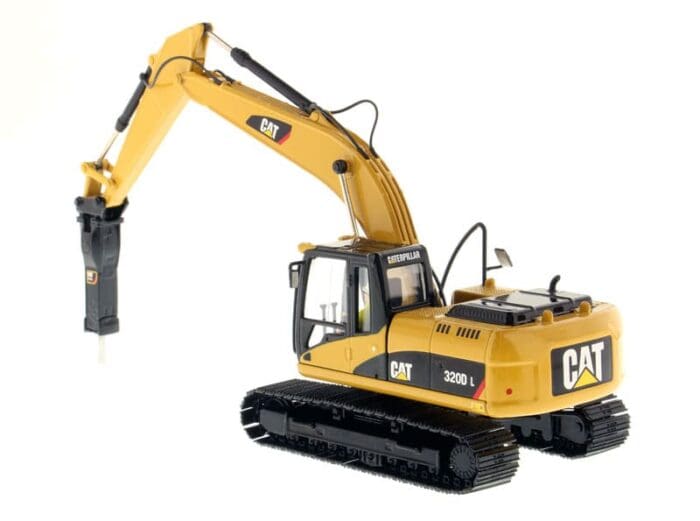 A yellow cat 3 2 0 d l excavator with a large piece of metal.
