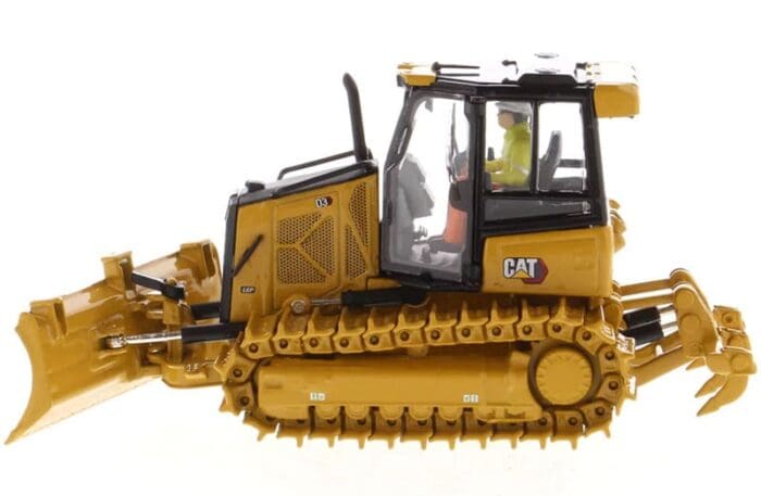 A cat bulldozer with a man sitting on the cab.