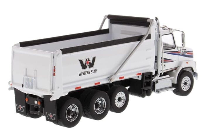 A white dump truck with the western star logo on it.