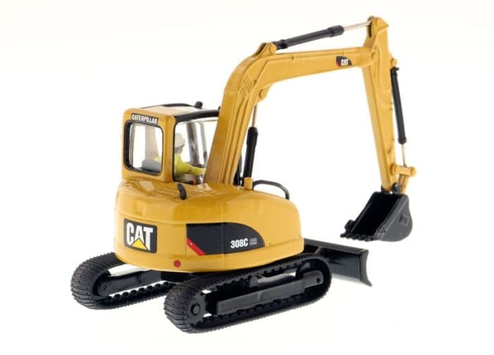 A yellow cat mini excavator with black bucket.