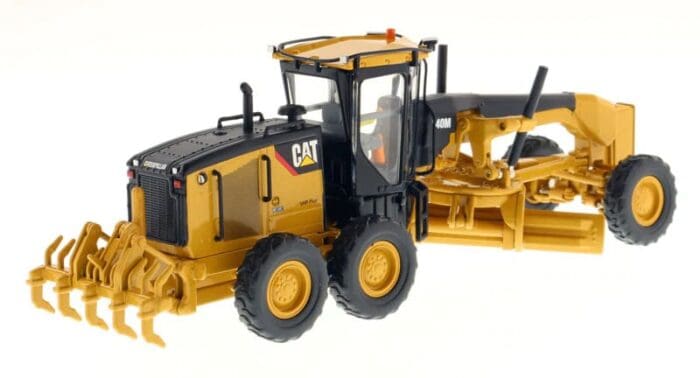 A cat grader is shown with the front end open.