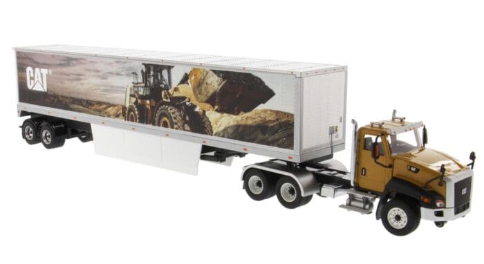 A tractor trailer truck with a picture of a rock pile.