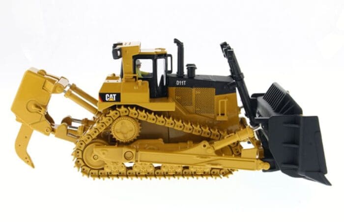 A yellow and black cat bulldozer on display.