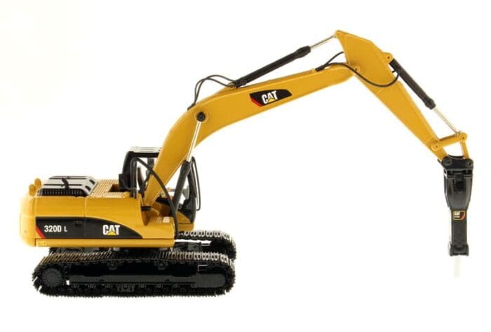 A yellow cat excavator is parked on the ground.
