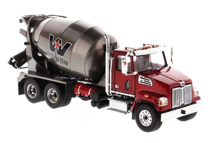 A red truck with a cement mixer on the back.