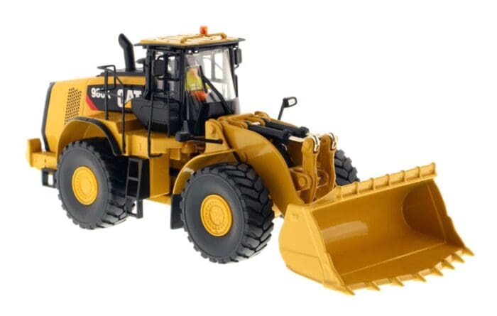 A yellow and black toy tractor with a large front loader.