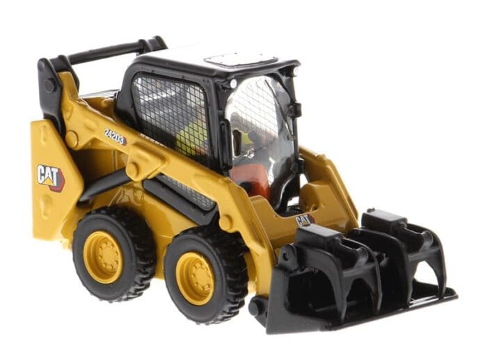 A toy cat skid steer with a black and yellow construction mask on it's face.