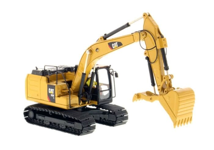 A yellow and black cat excavator with a large claw.