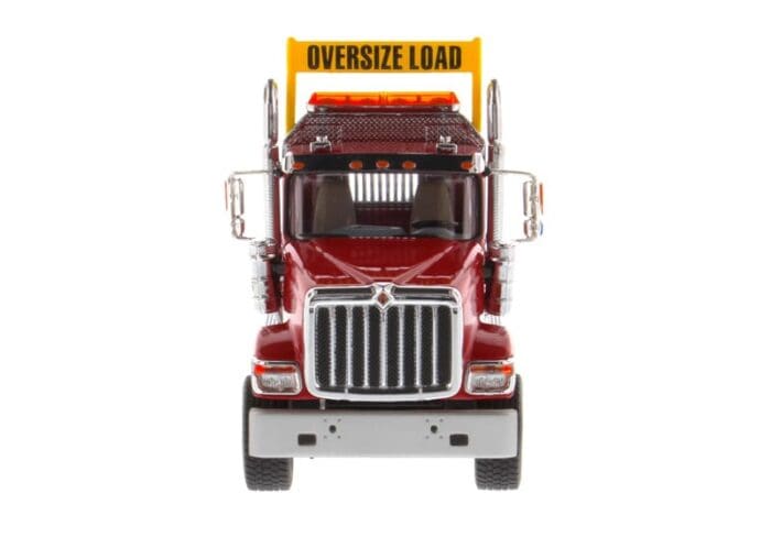A red truck with the words " oversize load ".