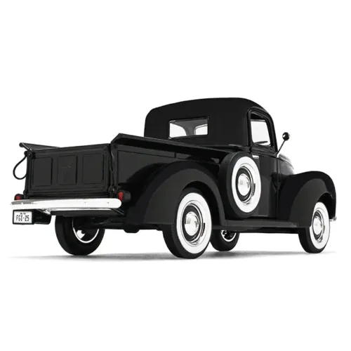 A black truck with white wheels is shown.