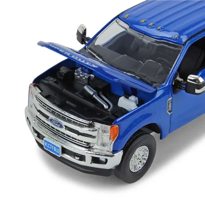 A blue truck with its hood open and the engine bay opened.