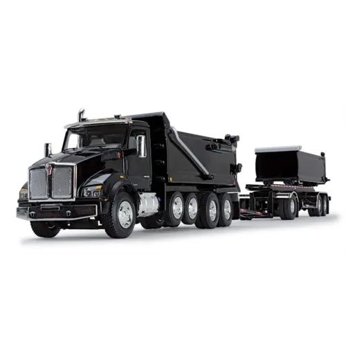 A black dump truck with trailer on the back.