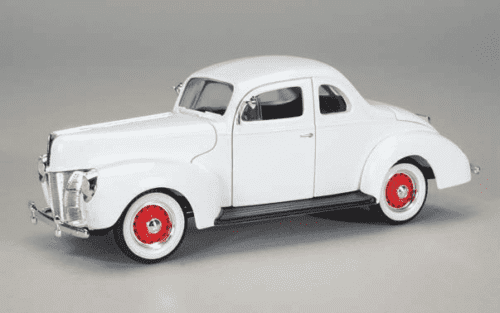 A white toy car with red wheels on the side.