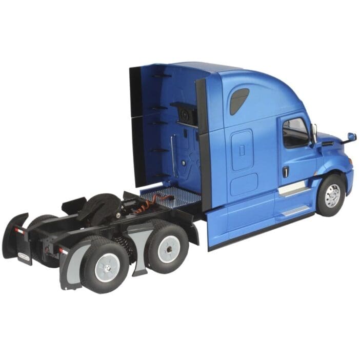 A blue semi truck with its cab open.