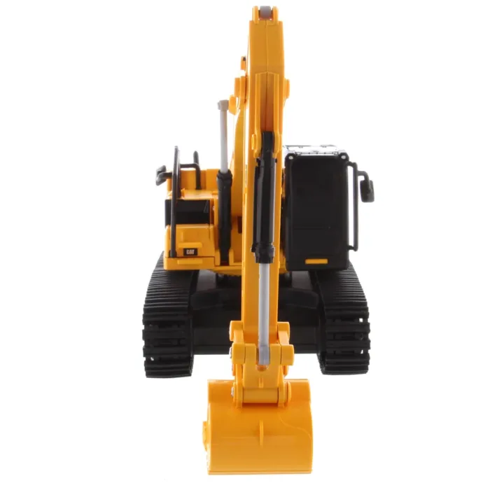 A toy excavator is shown with the front end open.