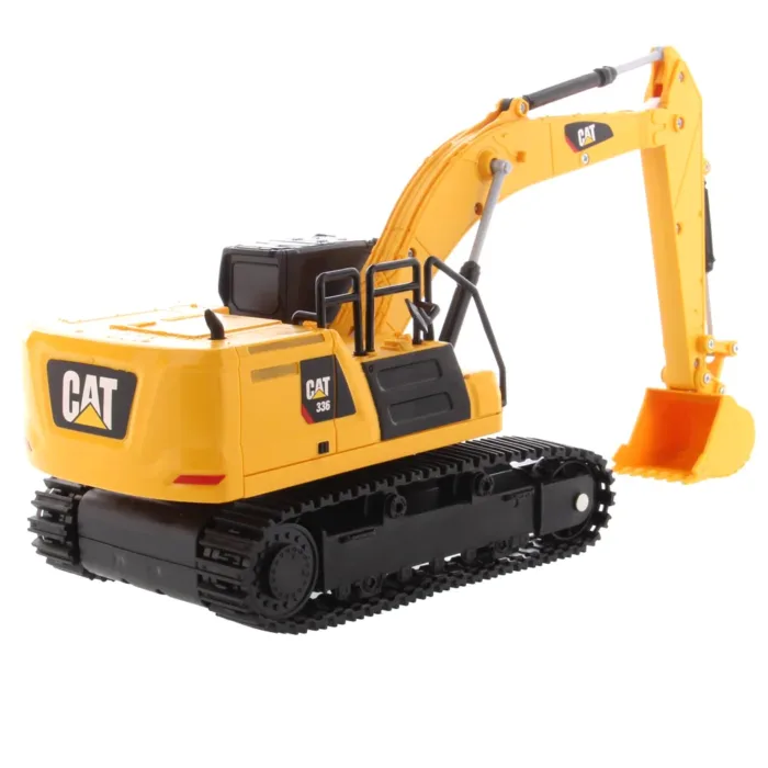 A yellow cat excavator is parked on the ground.