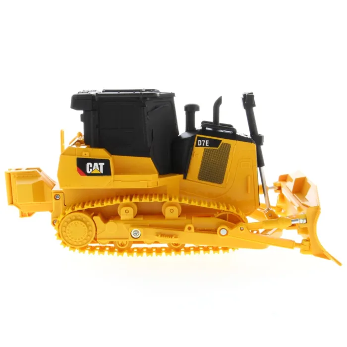 A yellow and black cat bulldozer is on the ground.