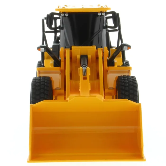 A yellow toy tractor with a large front end loader.
