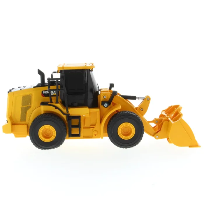 A yellow and black toy tractor is on the floor