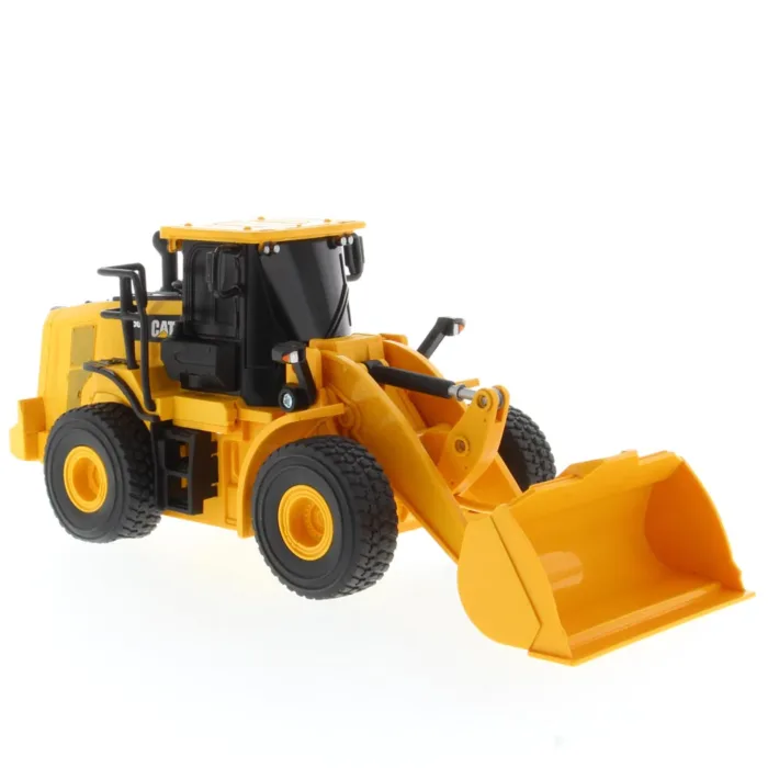 A toy wheel loader is shown with its bucket.