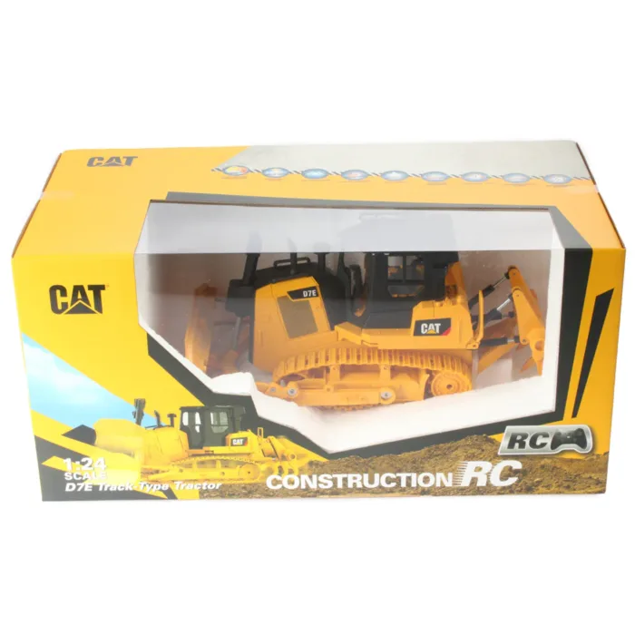A yellow cat construction truck is in its box.