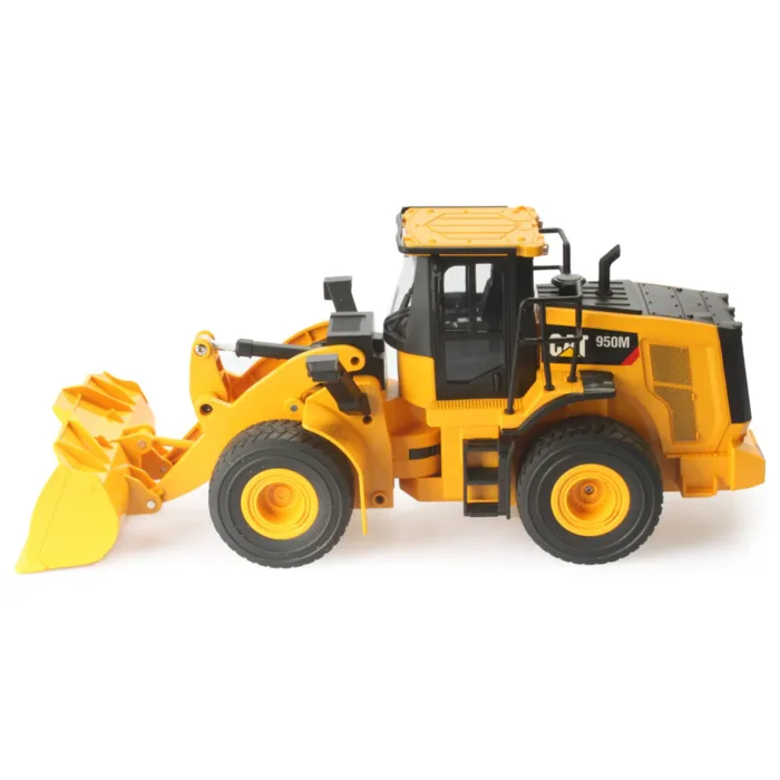 A yellow and black toy tractor is on the floor