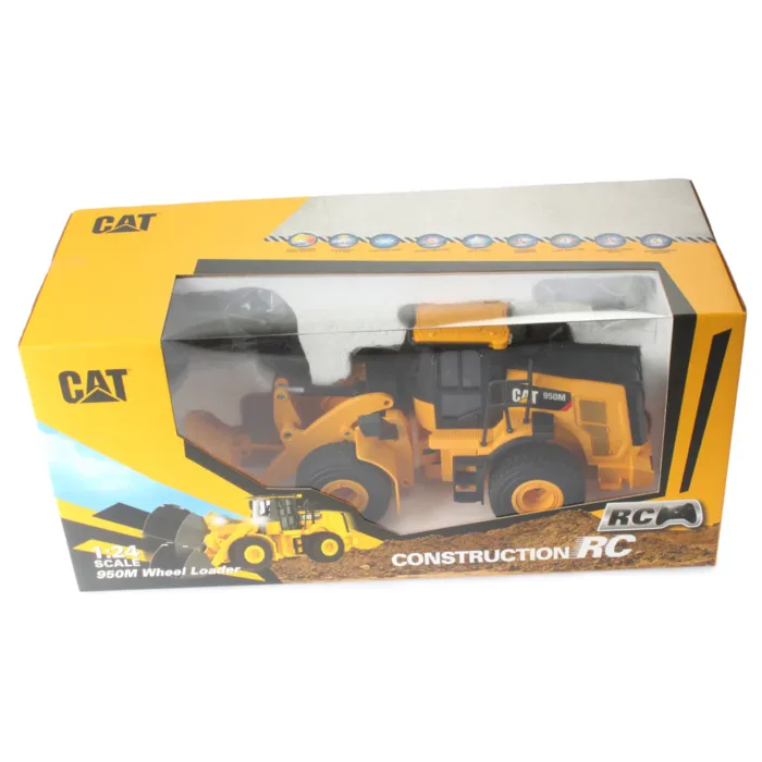 A yellow and black cat construction truck in box.