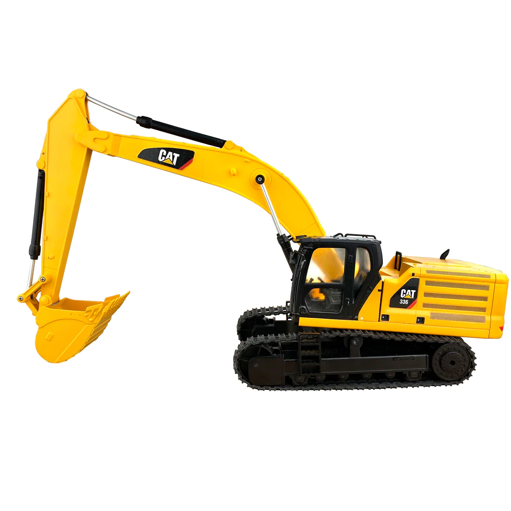 A yellow toy excavator is on the floor.