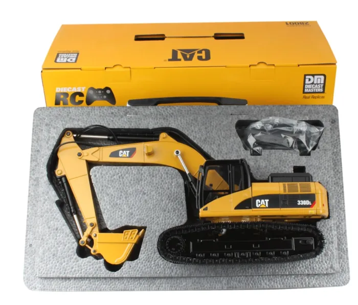 A toy cat excavator in its box.