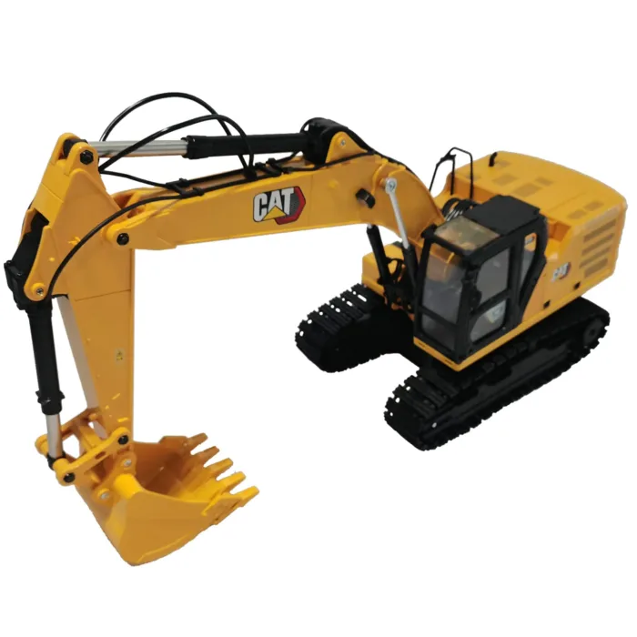 A toy excavator is shown with wires attached to it.