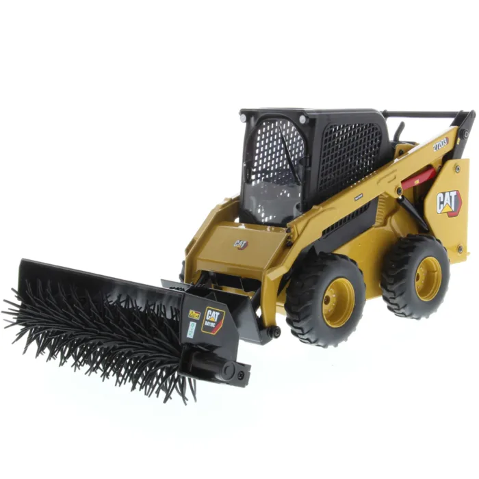 A yellow and black toy truck with a brush attachment.