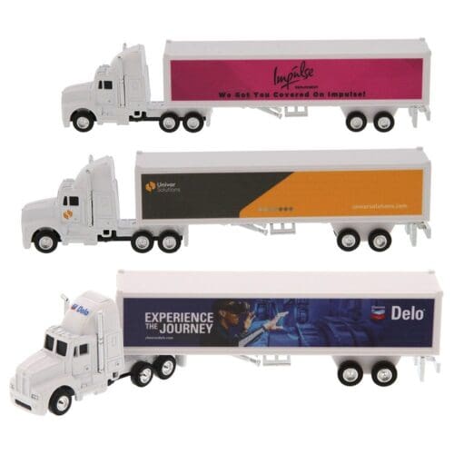 A toy semi truck with three different trailers.